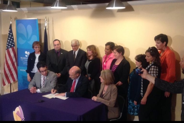 Wolf signs intimate-partner violence bill at Allentown LGBT center