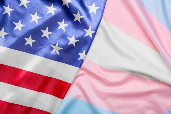 An American flag and a trans pride flag