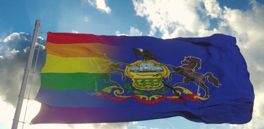 Adobe Stock Flag of Pennsylvania and LGBT. Pennsylvania and LGBT Mixed Flag waving in wind. 3d rendering rainbow PA