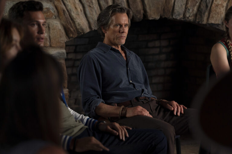 Kevin Bacon is back at camp in “They/Them”