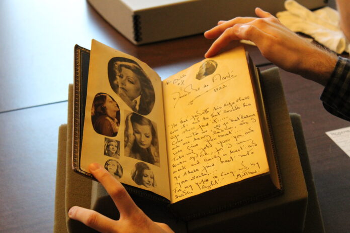 Bible of Mercedes de Acosta, featuring pasted-in glamor shots of Greta Garbo.