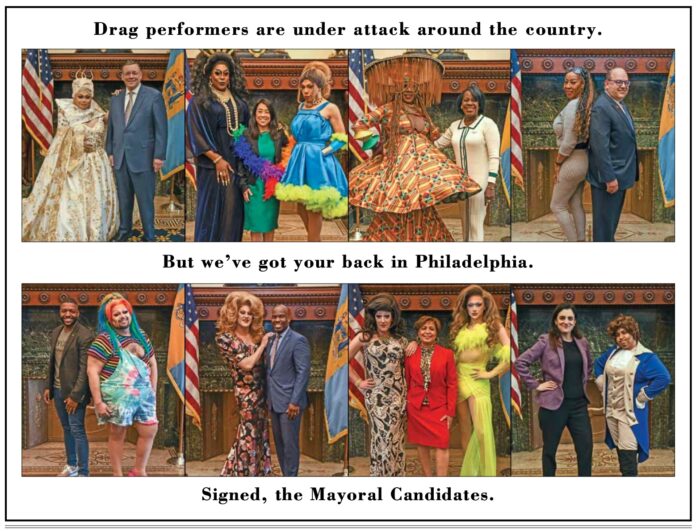 Mayoral candidates pose with local drag performers.