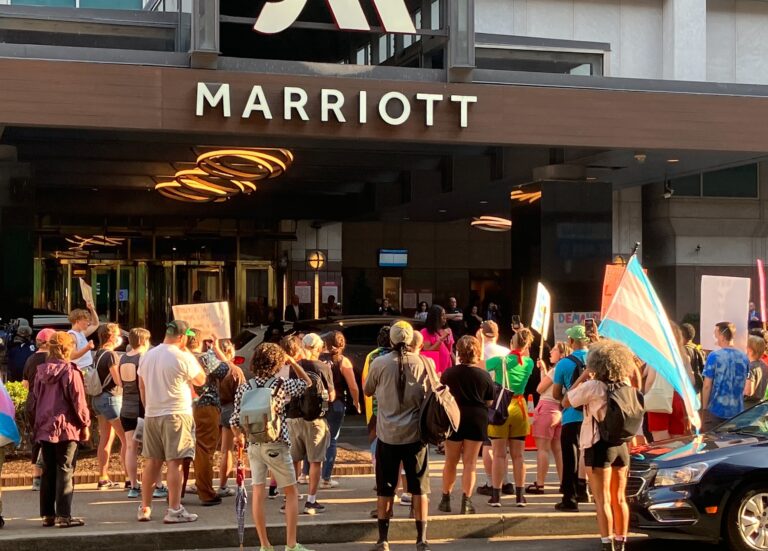 Protesters stand in front of the Philadelphia Marriott Downtown.