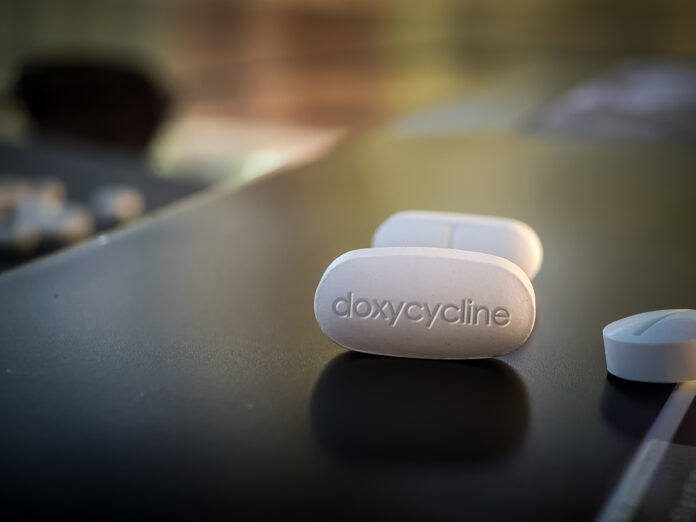 Doxycycline Pill antibiotic drug on black table