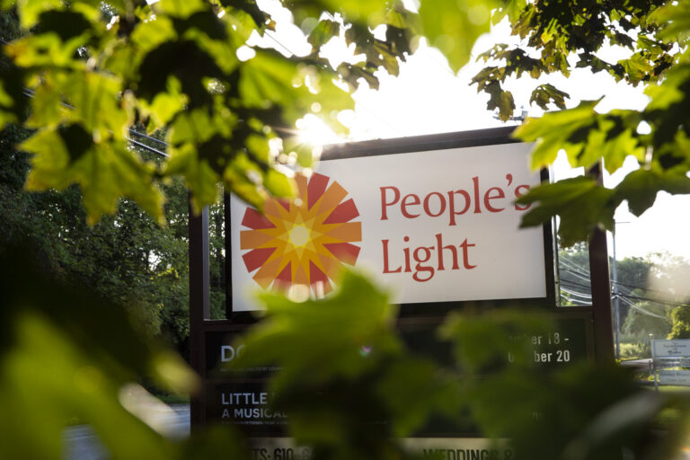 People's Light signs sits amid trees