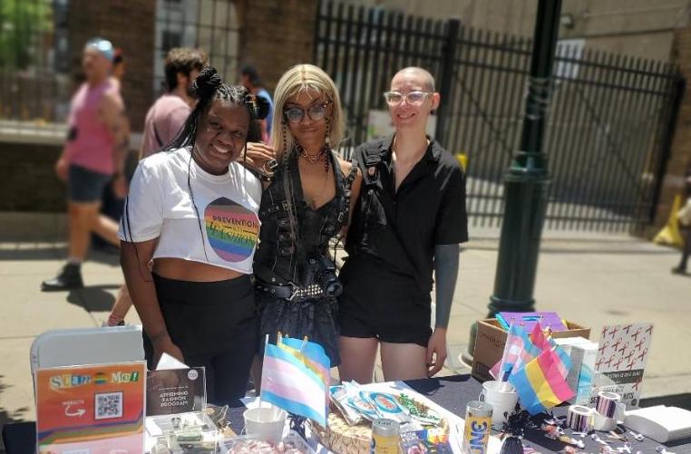From left, Prevention Meets Fashion founder Nhakia Outland and Sex Worker Prevention Project interns Nate Fireall and Laur Bonosevich.