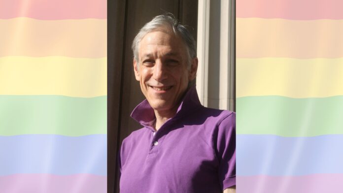 Headshot of Tom Wilson Weinberg over a transparent pride flag background