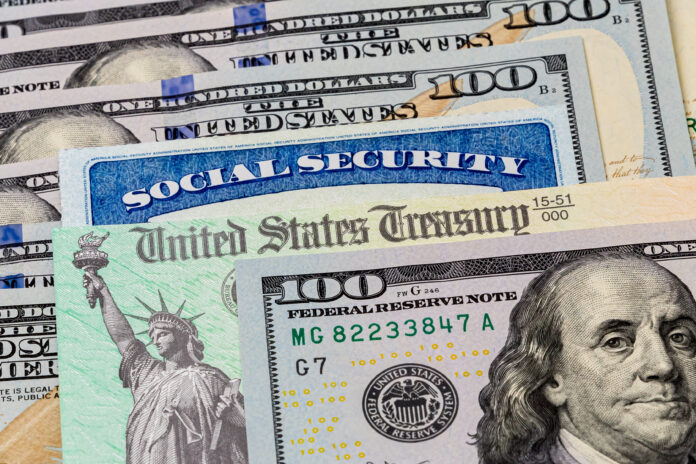 Social Security card, treasury check and 100 dollar bills.