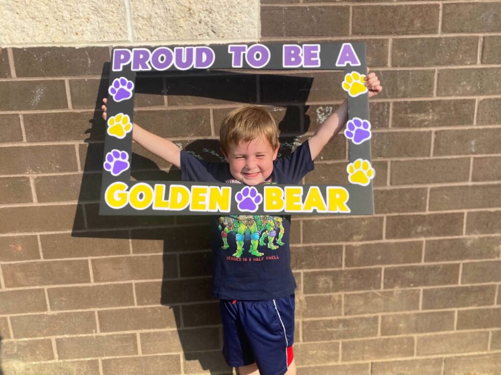 Jackson smiles with a frame around his head stating "PROUD TO BE A GOLDEN BEAR"