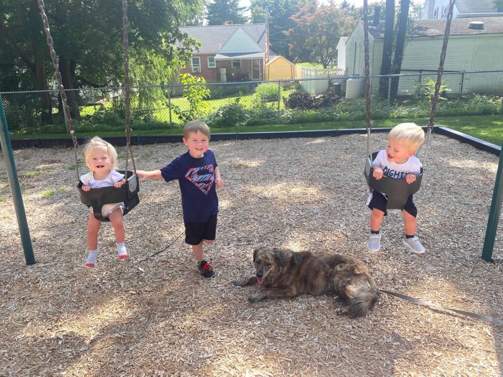 Jackson, August and Avery play at a park.