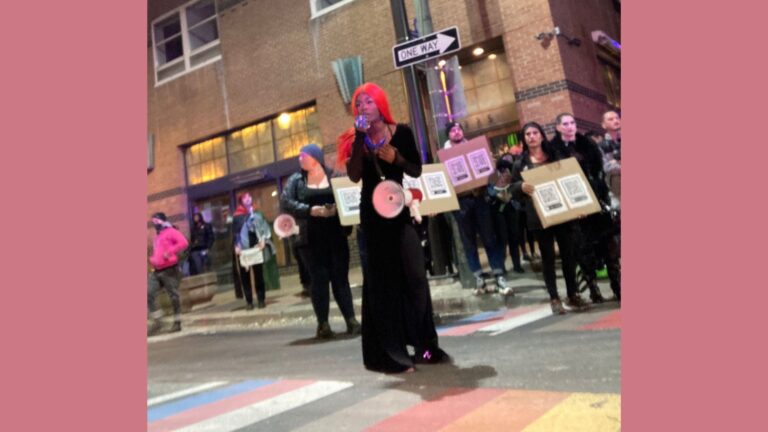 Shakita Karr, a trans drag artist, speaks to protestors before performing during the demonstration.
