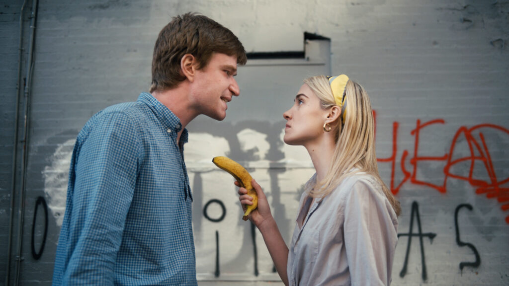 From left, Jacob Roberts and Annabel O’Hagan in a scene from ‘Half.’ Annabel is pointing a banana at Jacob.