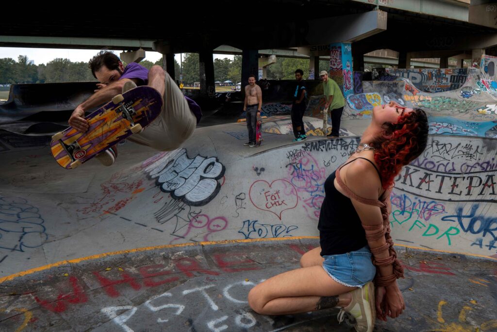 People pose in a skate park