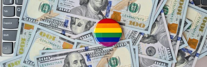 LGBT pride flag for gay community money on keyboard.