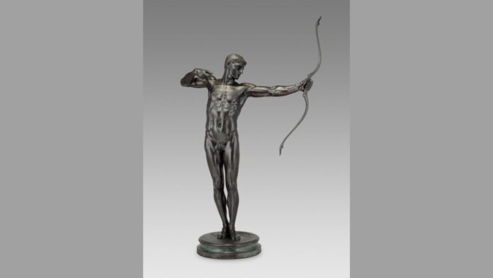‘Tuecer, Brother of Ajax’ by Hamo Thornycroft. It's a statue of a naked man drawing a bow and arrow.