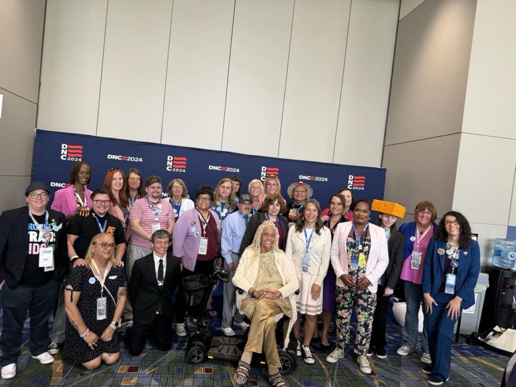 Trans and nonbinary delegates gather for a photo at the Democratic National Convention in 2024.