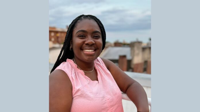 Sabrina Henry smiles for the camera.