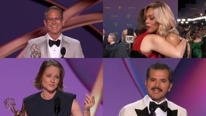 The image shows moments from the 2024 Emmys: Top left: Greg Berlanti, wearing a light-colored tuxedo and glasses, smiles while holding his Emmy award on stage. Top right: Nava Mau in a red outfit embraces Laverne Cox, who has blonde hair, on the red carpet. Bottom left: Jodie Foster, in a sleeveless dress, speaks into a microphone while holding her Emmy. Bottom right: John Leguizamo, sporting a mustache and wearing a tuxedo, addresses the audience from the podium.