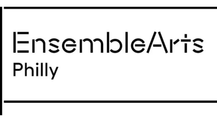 The image contains a minimalist logo for "Ensemble Arts Philly" in black text. The word "Ensemble" uses a modern, geometric font with a distinct forward slash separating "Arts," and both words are centered within a simple rectangular black border.