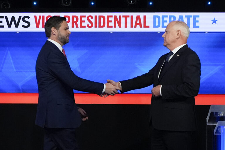 Republican vice presidential nominee Sen. JD Vance, R-Ohio, left, and Democratic vice presidential nominee Minnesota Gov. Tim Walz, shake hands as they arrive for a CBS News vice presidential debate, Tuesday, Oct. 1, 2024, in New York.