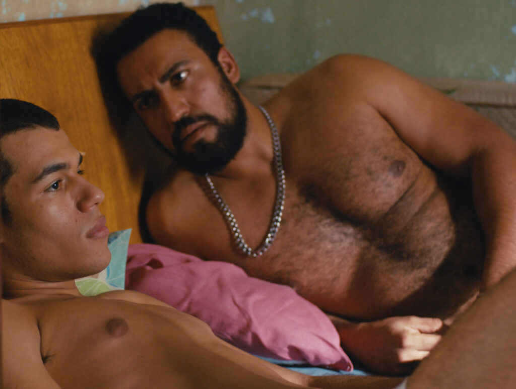 Two shirtless men in bed together in a still from 'Baby,' which is screening at the Philadelphia Film Festival,