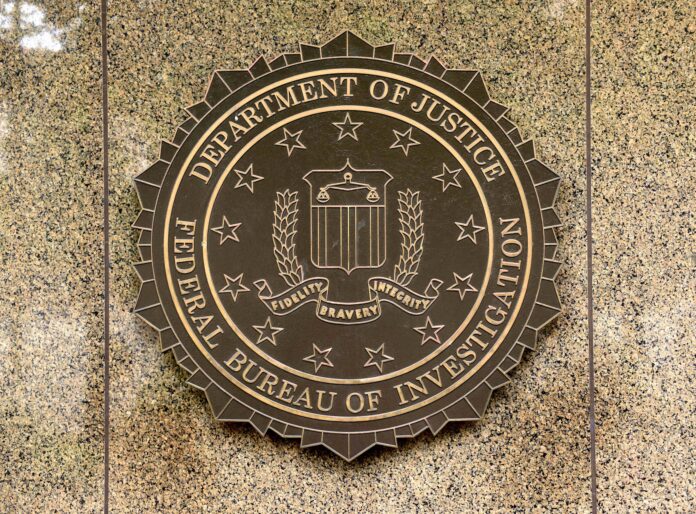 Washington, DC - June 02, 2018: FBI, Federal Bureau of Investigation seal on the Headquarters Edgar Hoover FBI Buildingin in Washington.