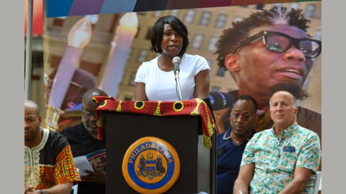 Celena Morrison-McLean speaks during a street dedication for Michael Hinson, Jr. on the 1200 block of Chestnut Street in June 2024.