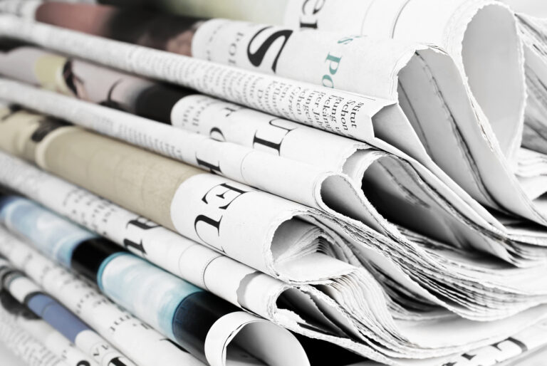 Pile of old newspapers, selective focus